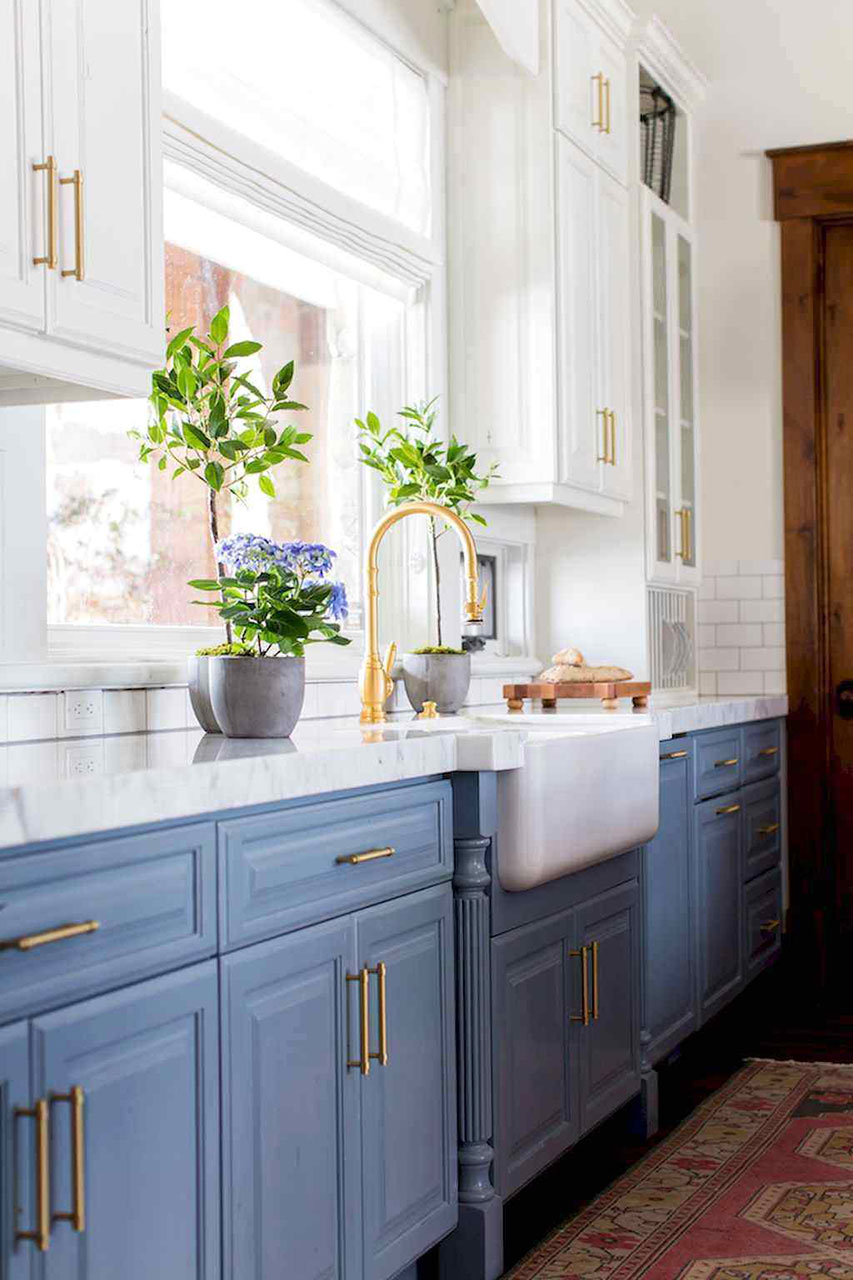 blue-kitchen-cabinets-with-gold-piper-handles