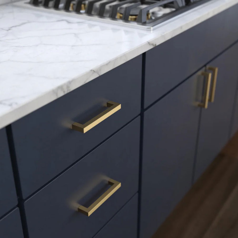 Hickory Heritage Designs Gold Handles on Blue Cabinetry